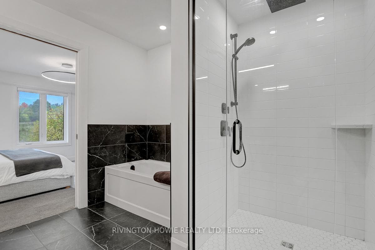 Soaker tub and separate shower featured.