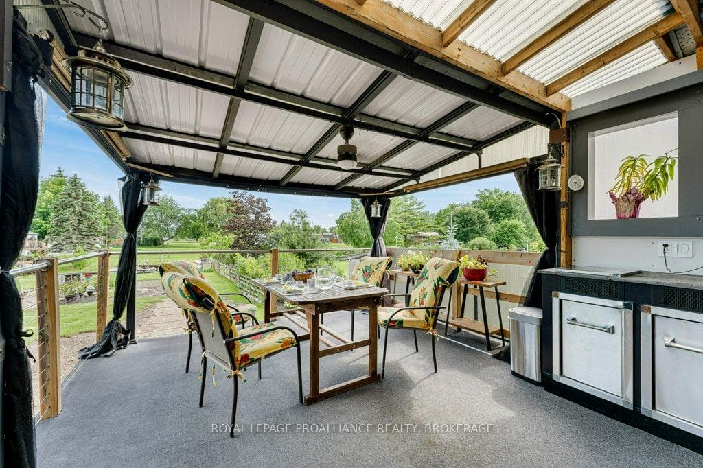 Deck off Kitchen with outdoor cooking centre.