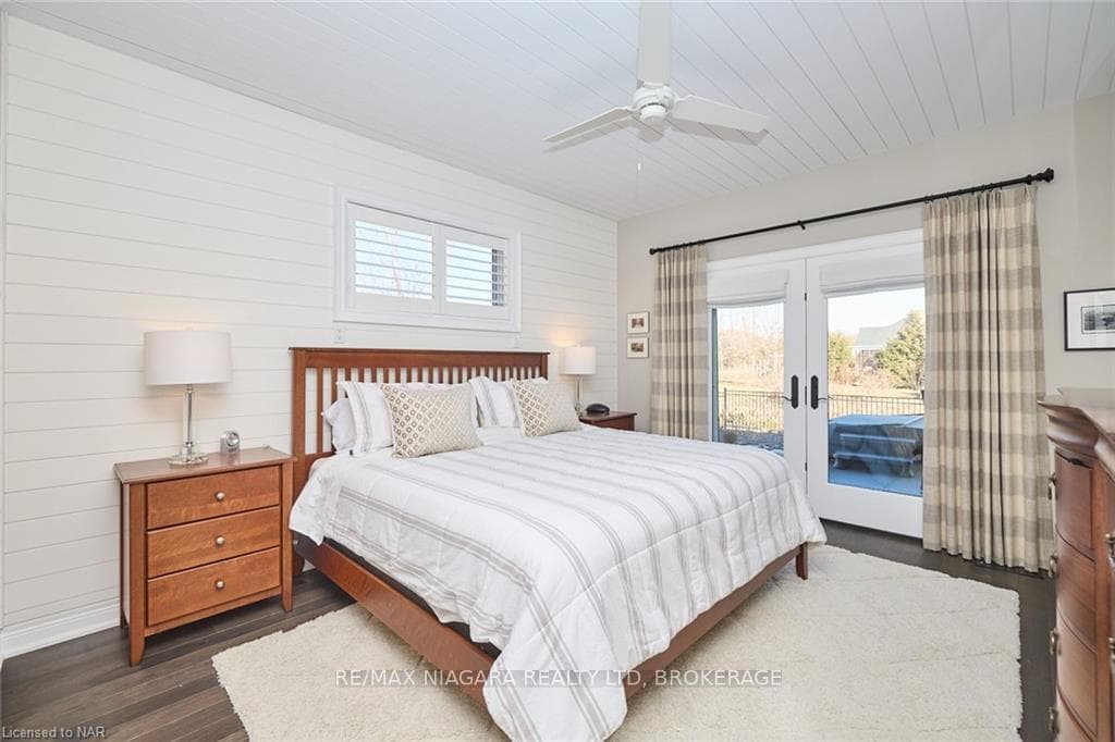 Primary Bedroom with garden doors to back deck, 6p