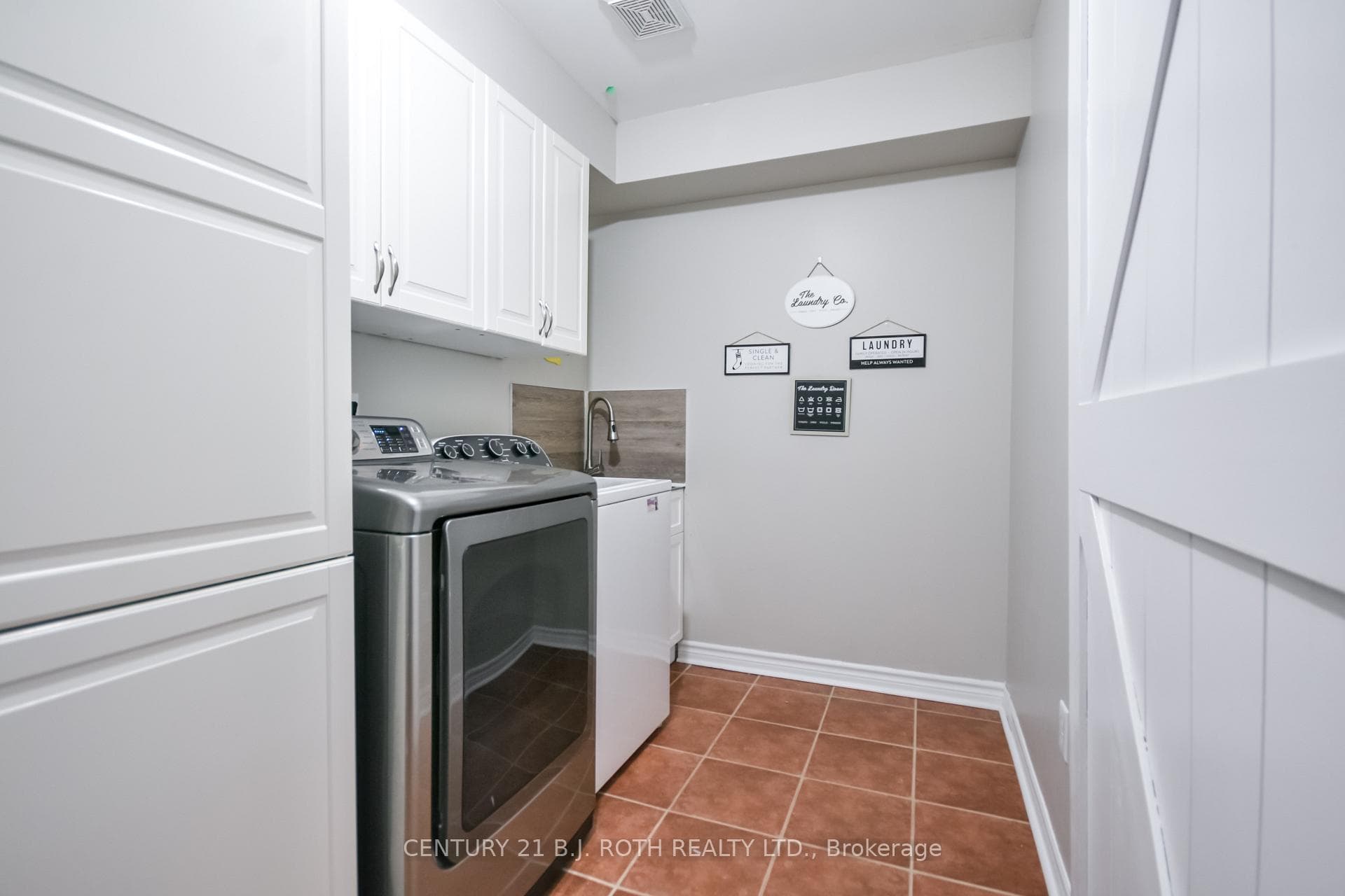 Laundry rm with huge pantry & garage access.