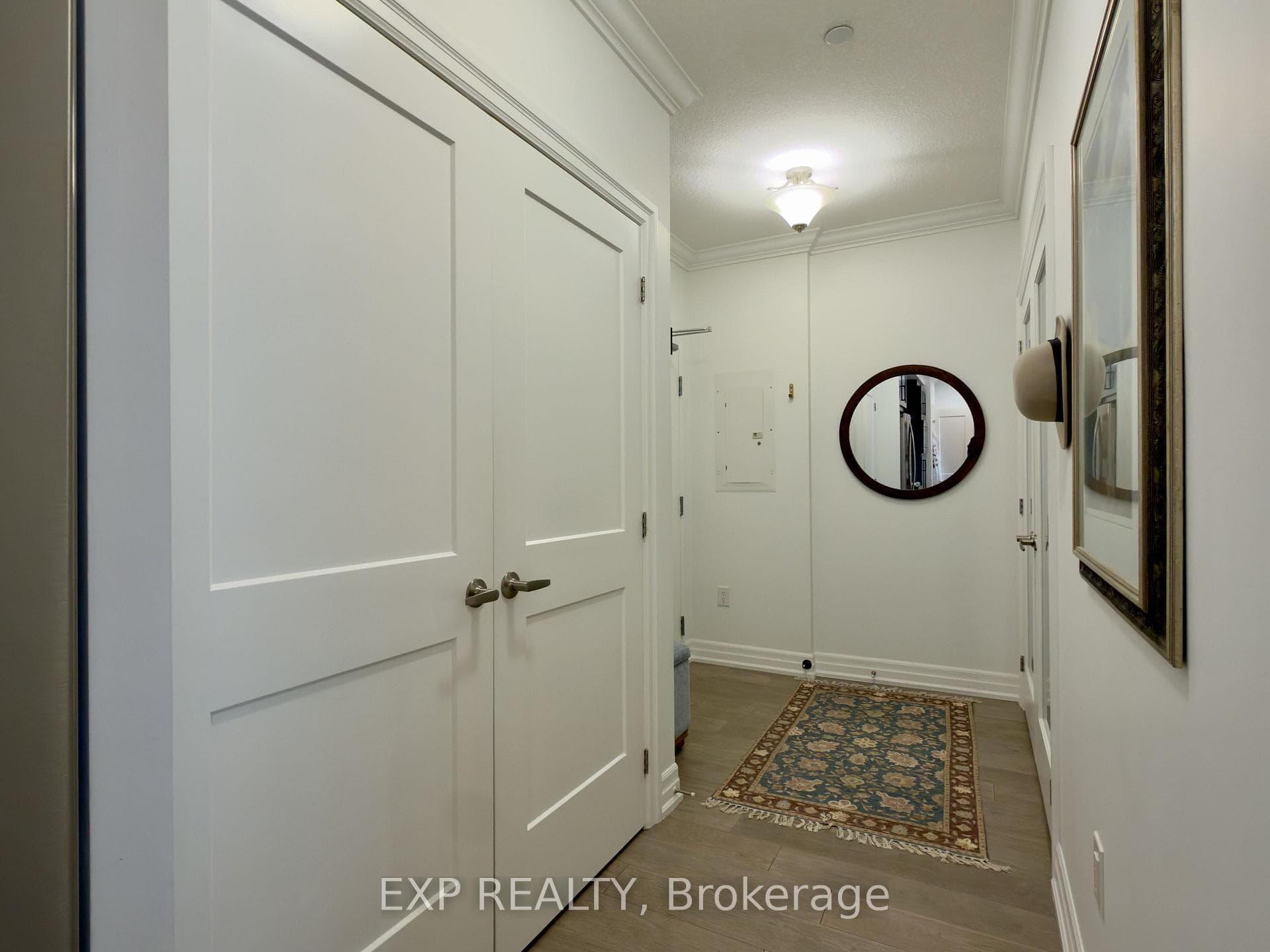 Bright foyer with wood floors.