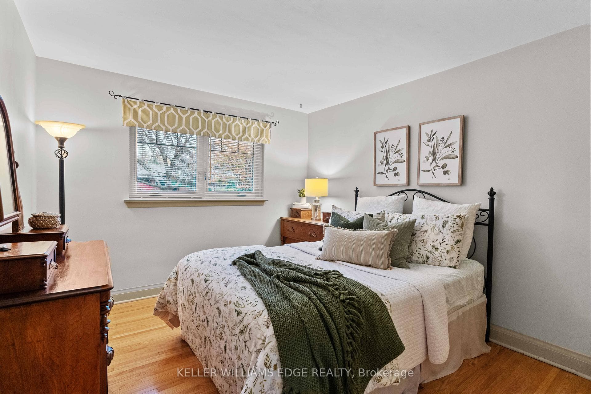 Primary bedroom with original hardwood flooring
