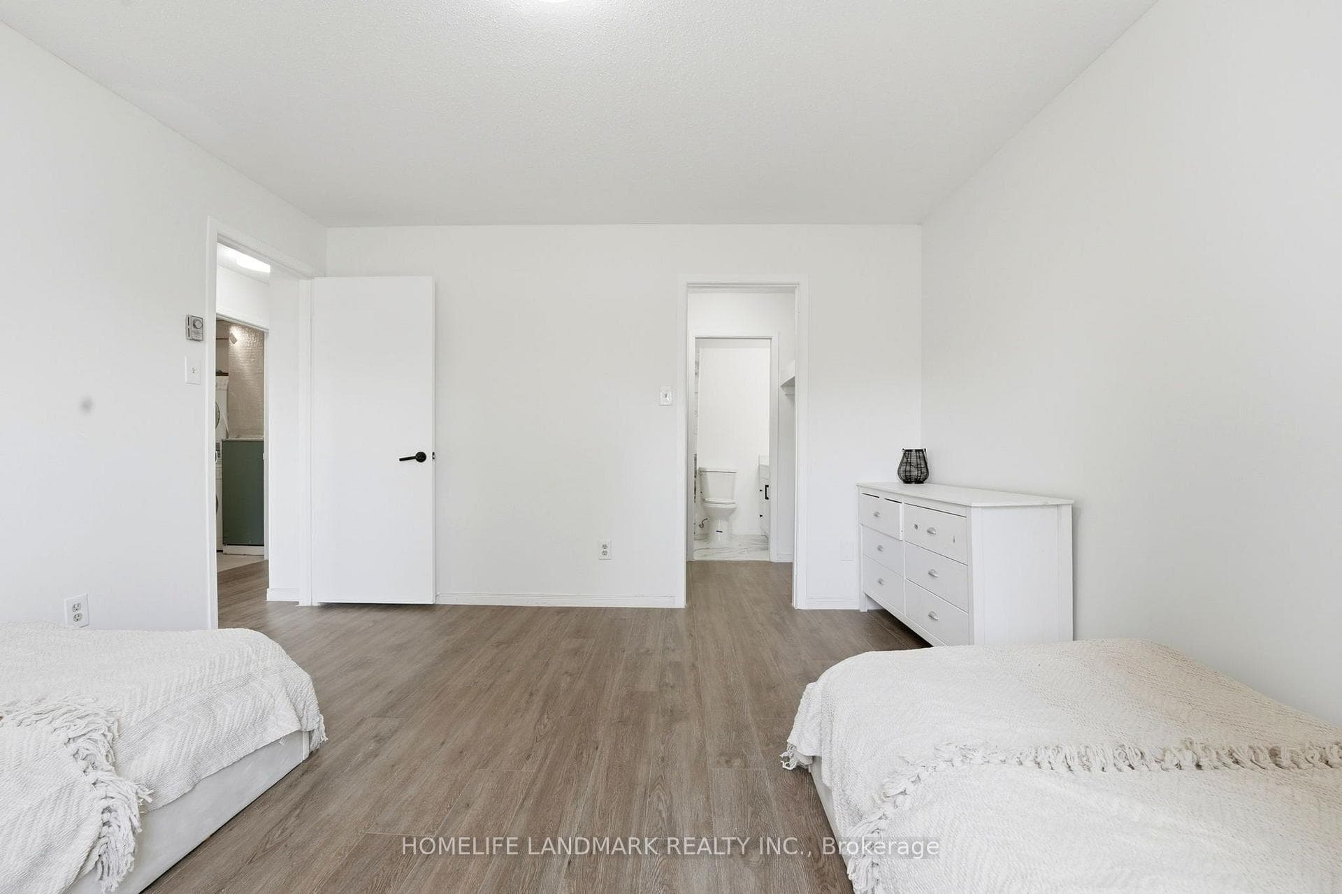 Walkin closet in master bedroom leading to bathroo