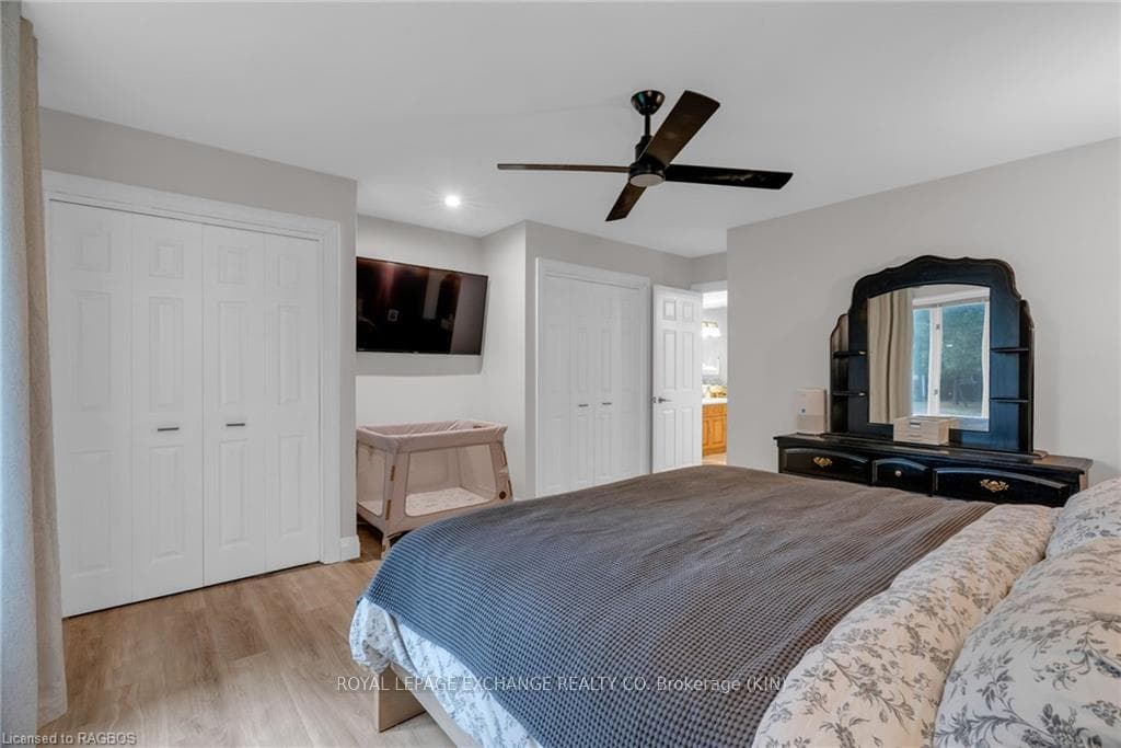 Primary bedroom with his and her double closets