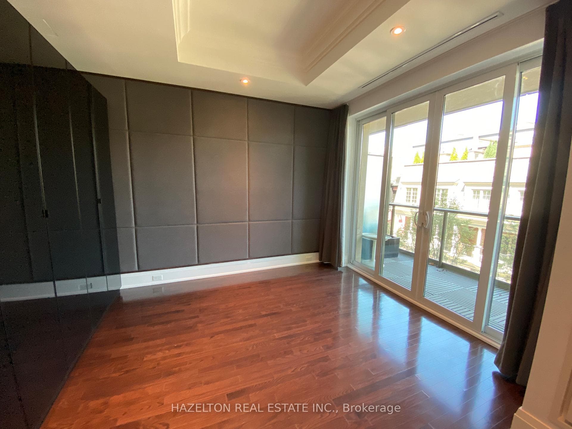 Primary Bedroom with custom upholstered wall