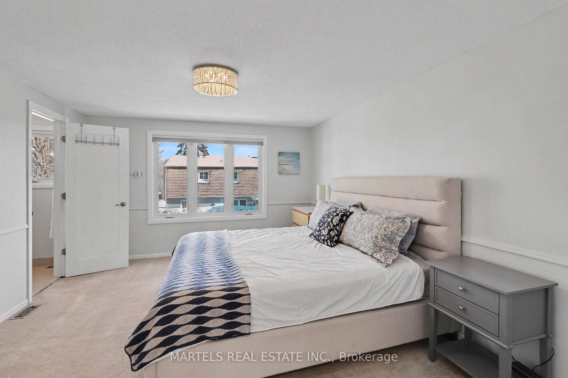 Comfortable size primary bedrm with larger window