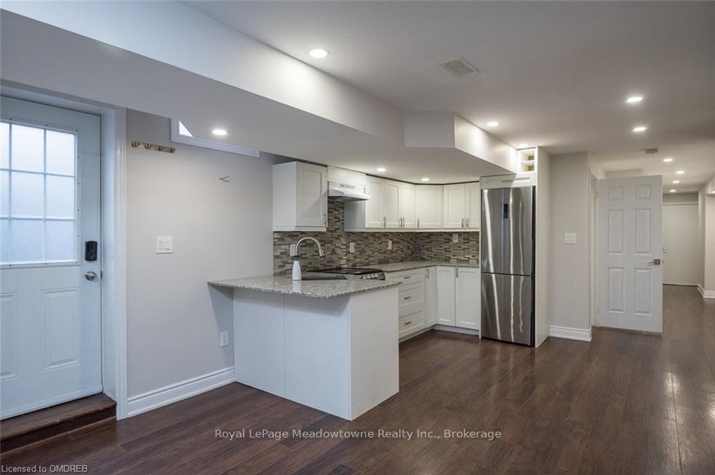 Separate entrance to the bsmt. Kitchenette with ga