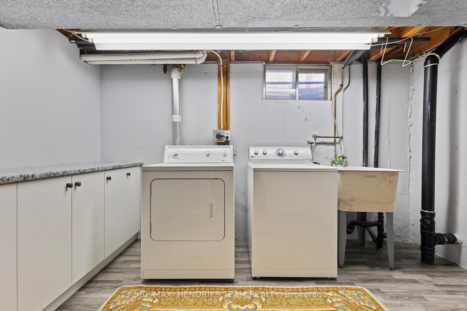 Laundry room with built-in cabinets
