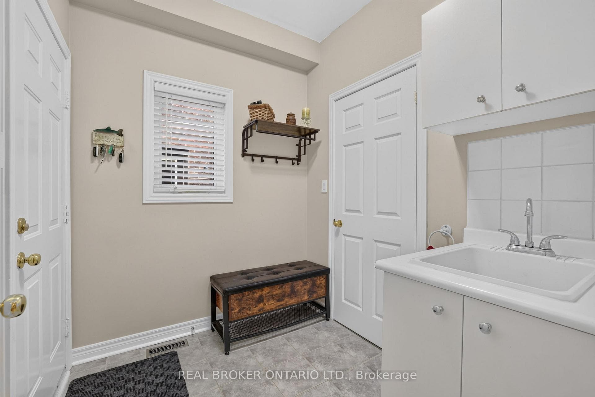 Mudroom with Garage Access, Closet & Laundry Sink
