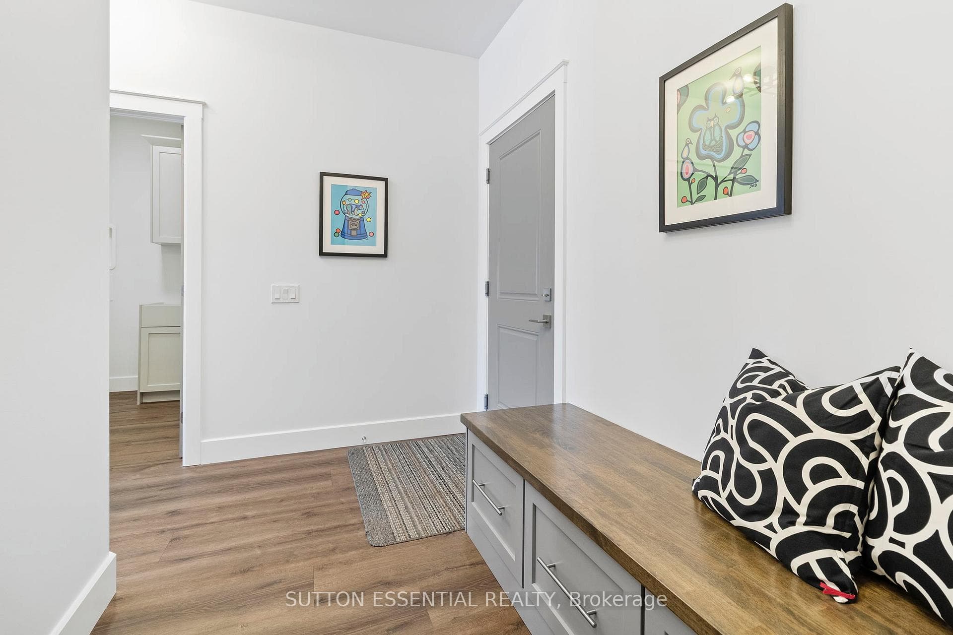 Mudroom with custom bench and entry to garage