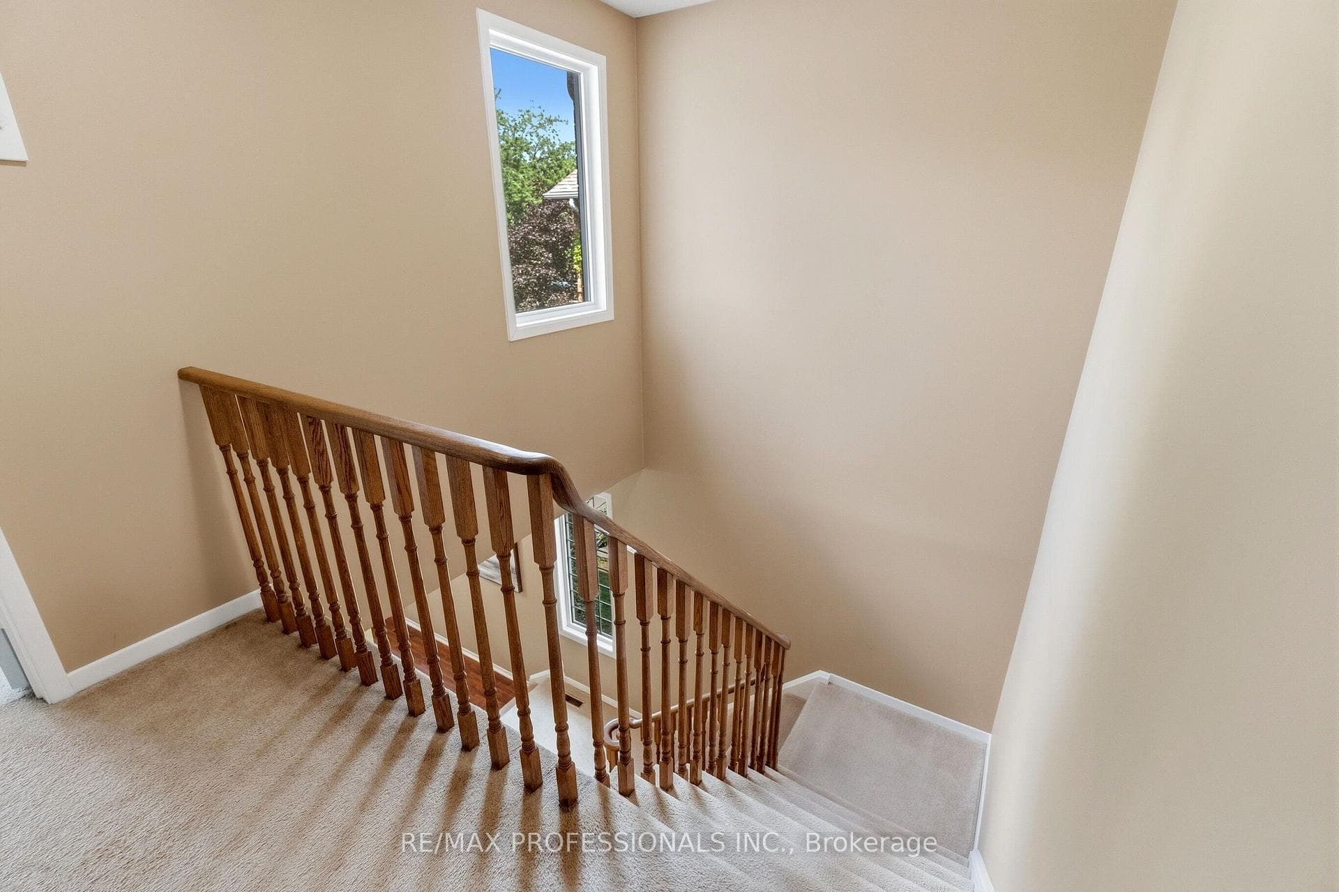 Stairway to Upper Level with Large Window