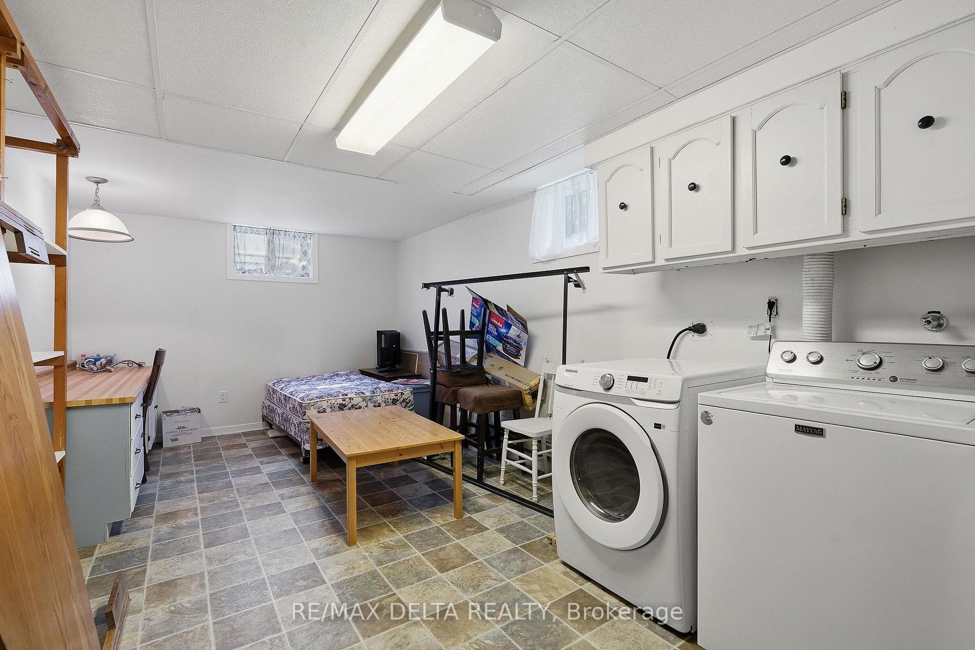 Laundry in basement, storage area.