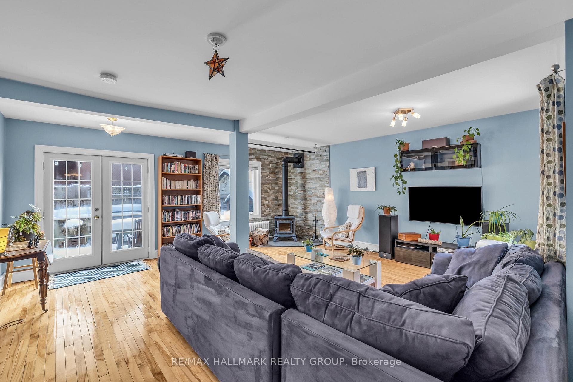 Family room with double doors to back deck
