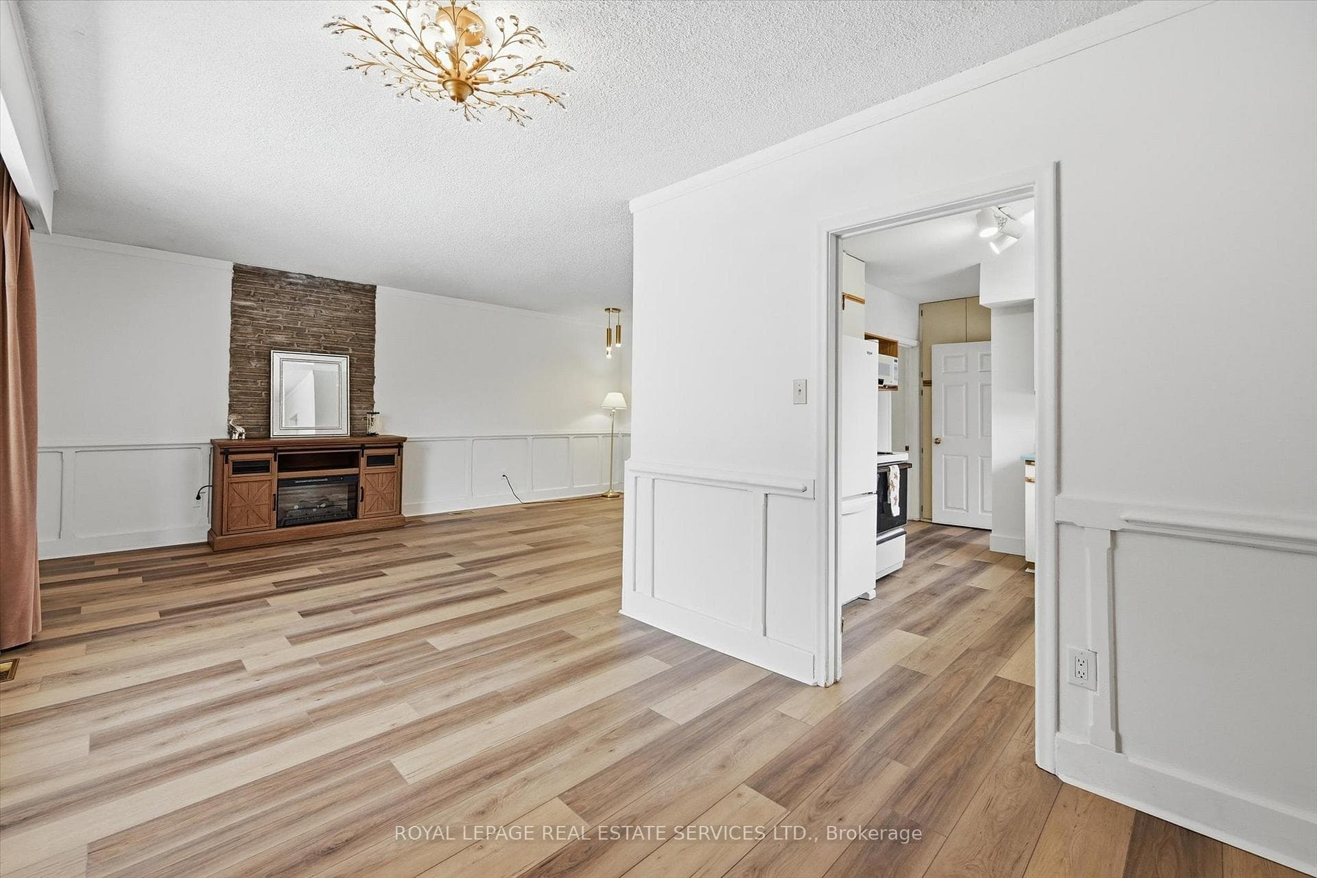 Open-Concept Living & Dining Areas w/Wainscoting