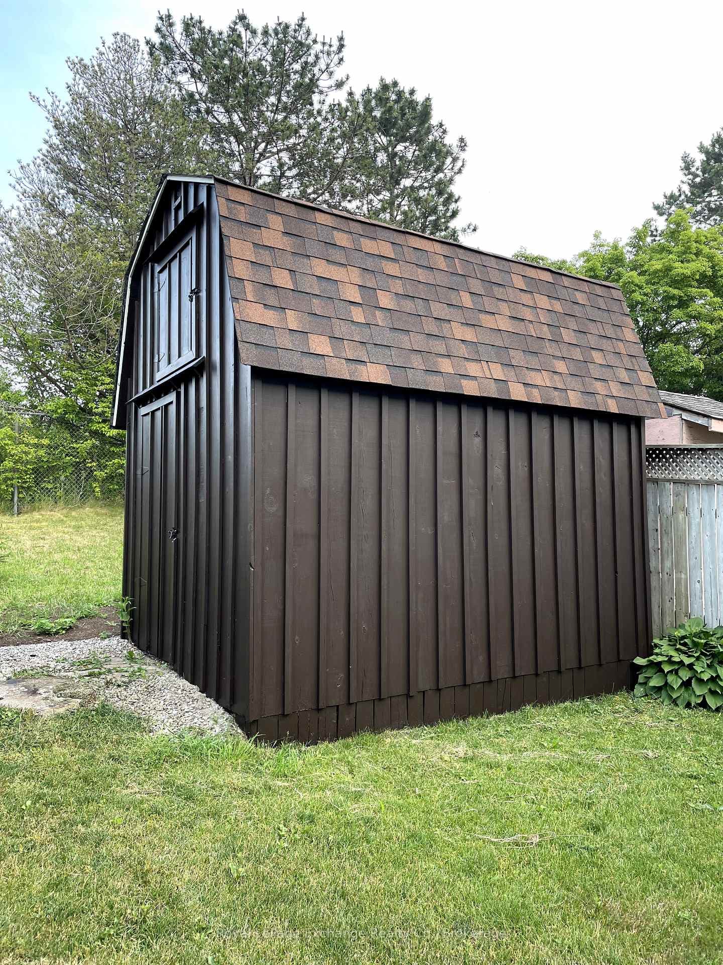 9x12 custom shed with new shingles.