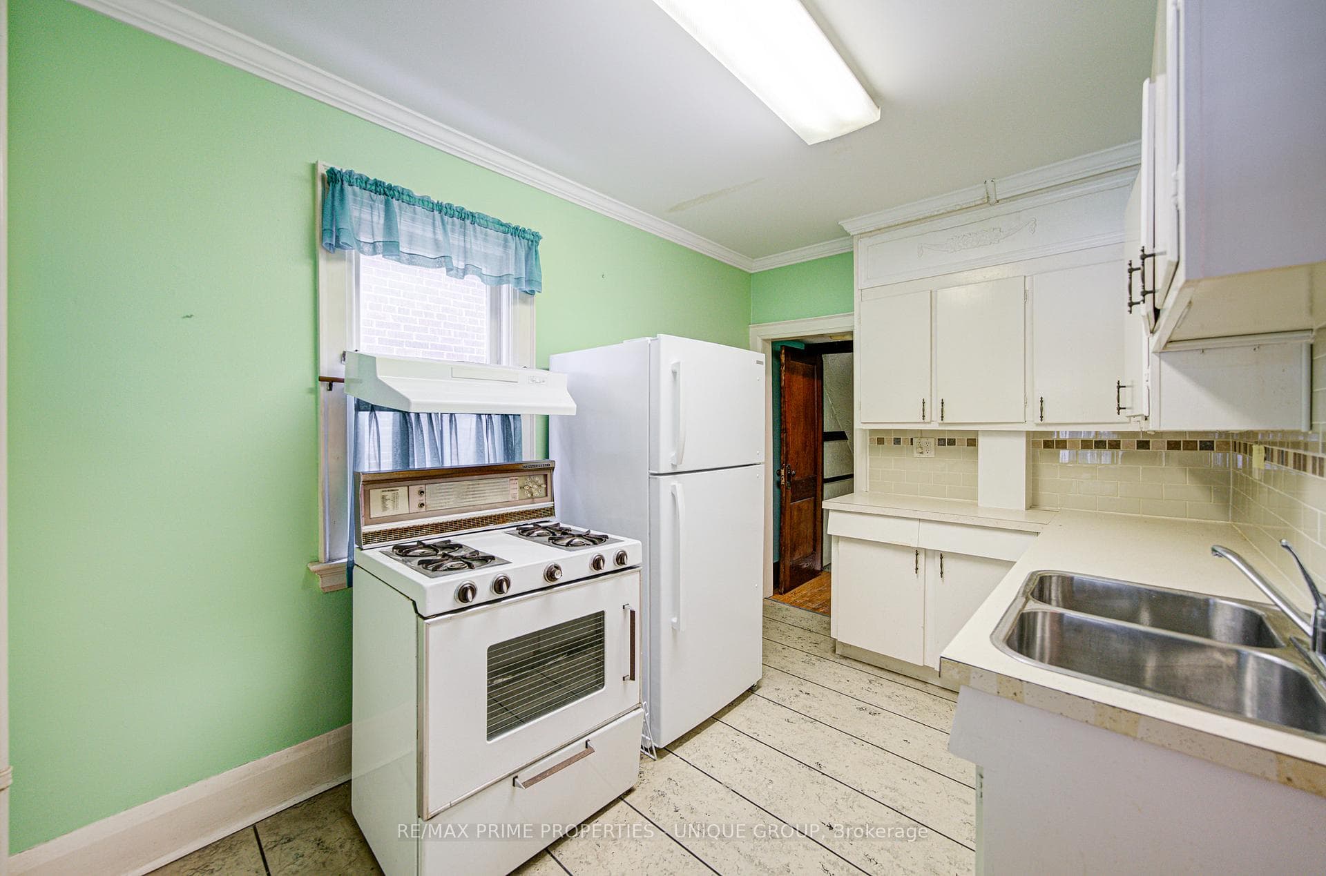 Kitchen with door to basement