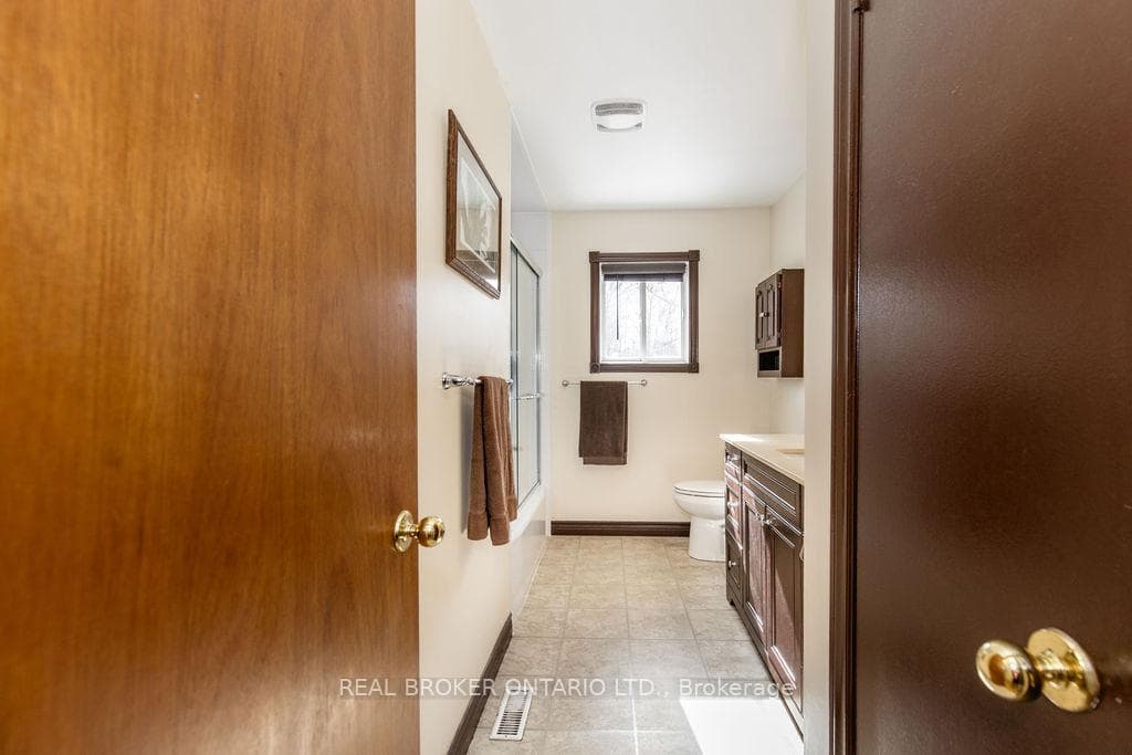 Main floor full bathroom with linen closet