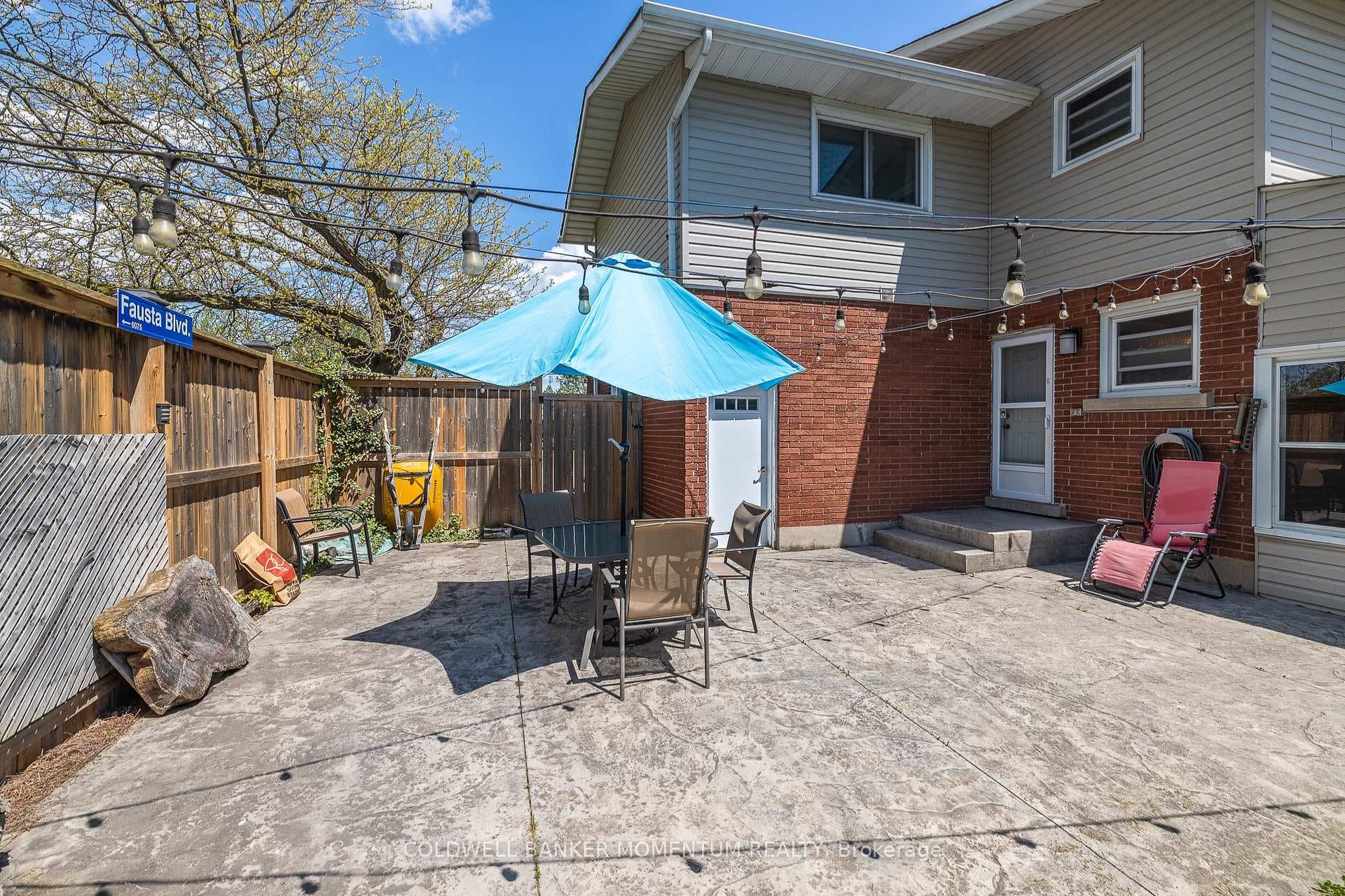 Stamped concrete patio with fully fenced yar