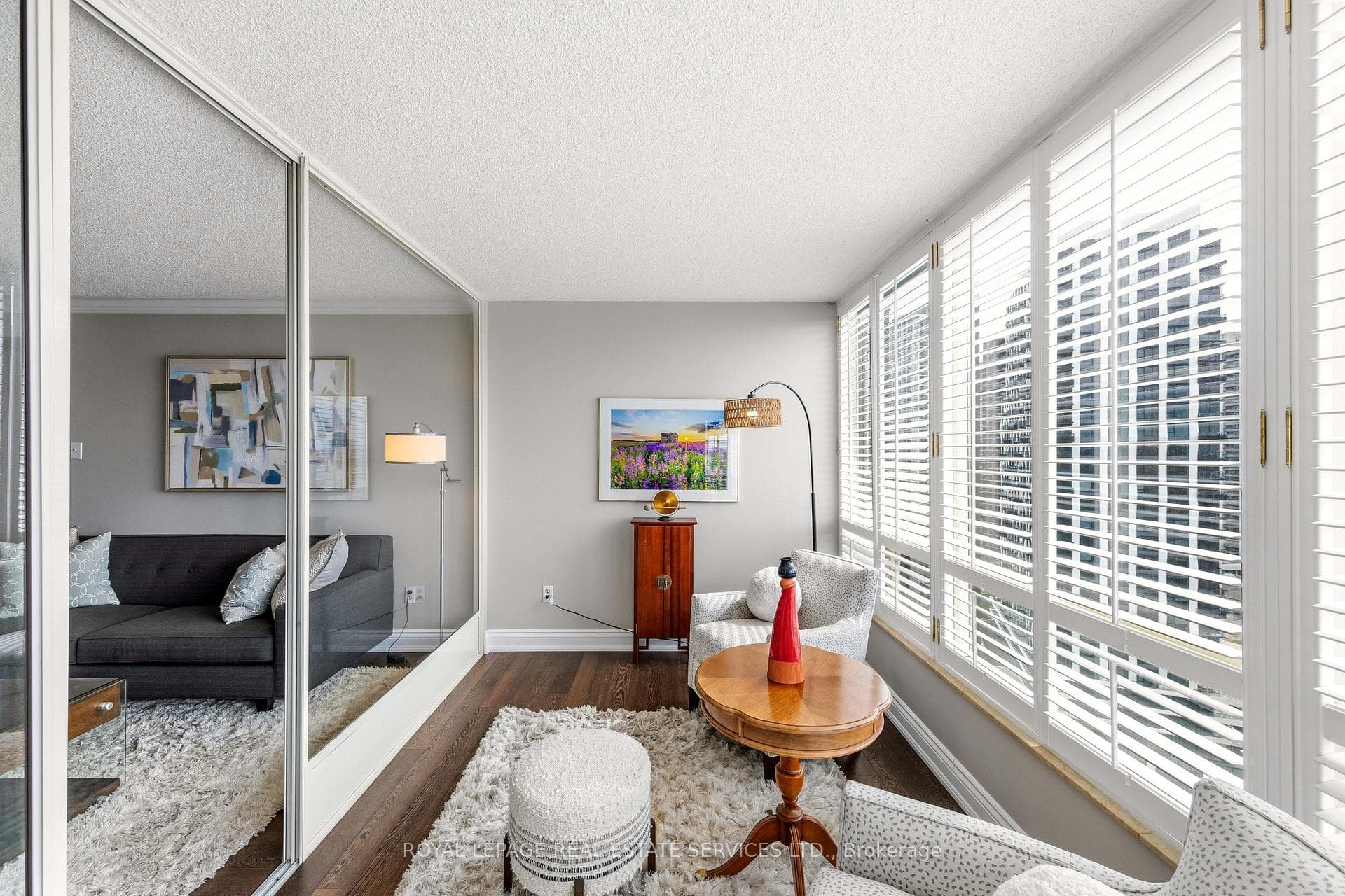 Bright, sun filled sunroom can function as a Den