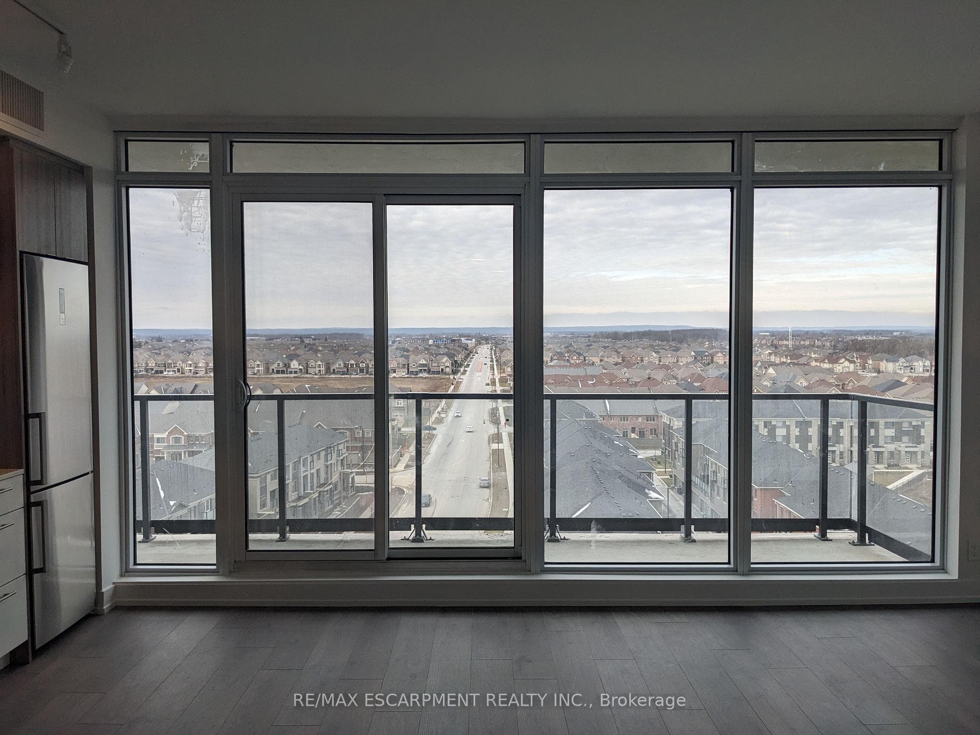 Floor to ceiling windows with walk-out to balcony