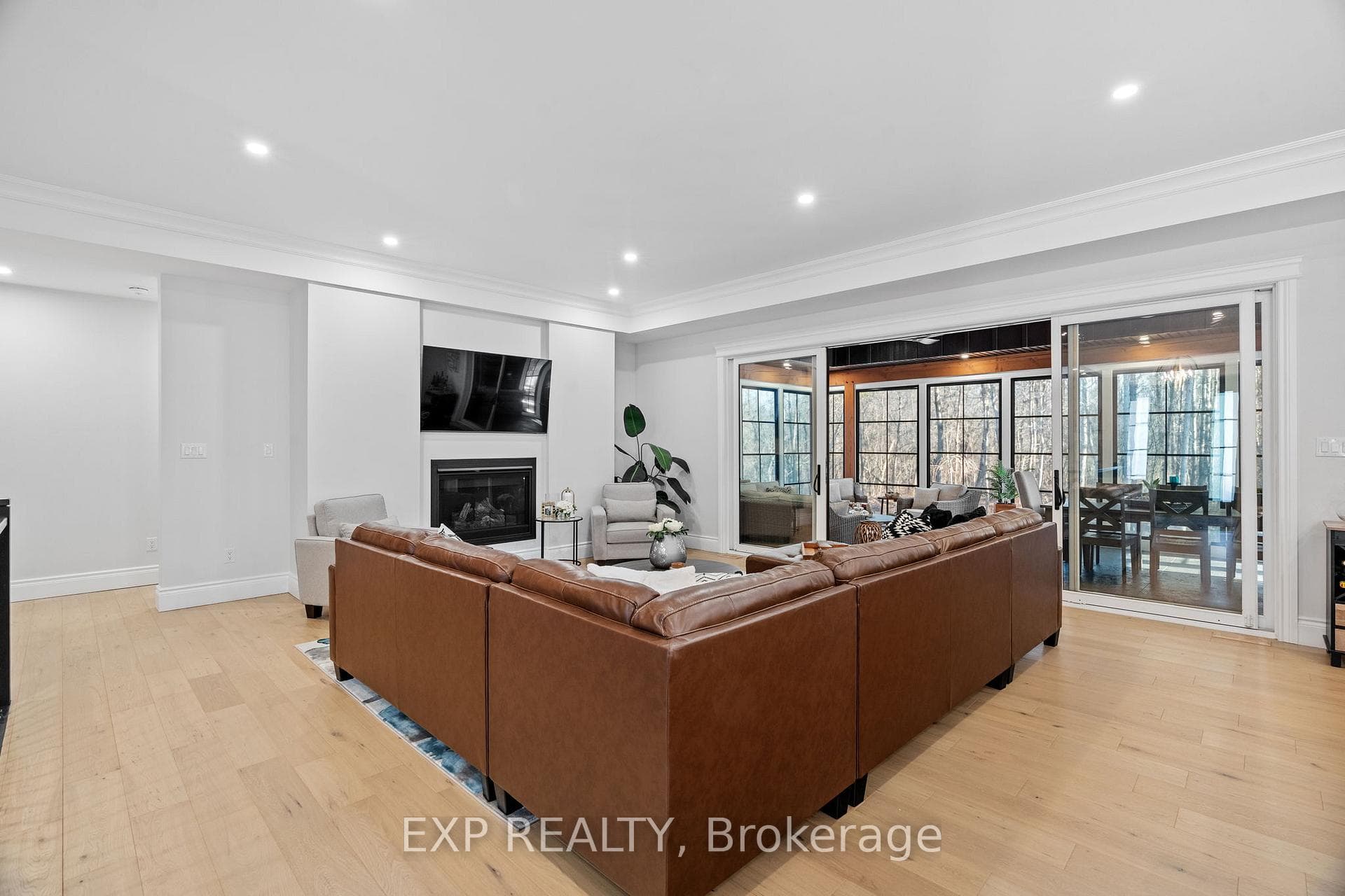 Living room with gas fireplace opens to patio