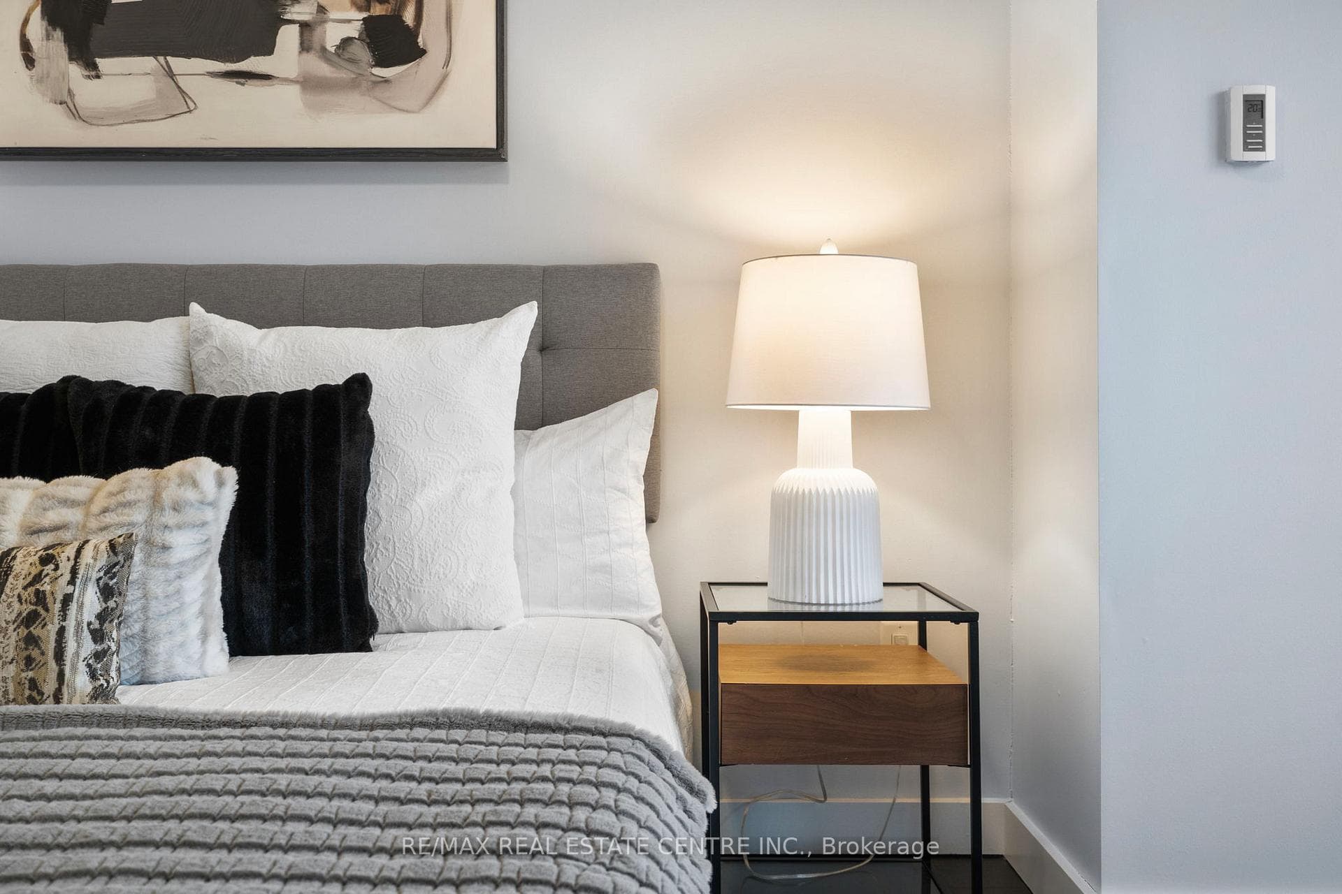 A primary bedroom easily fits a king-size bed.