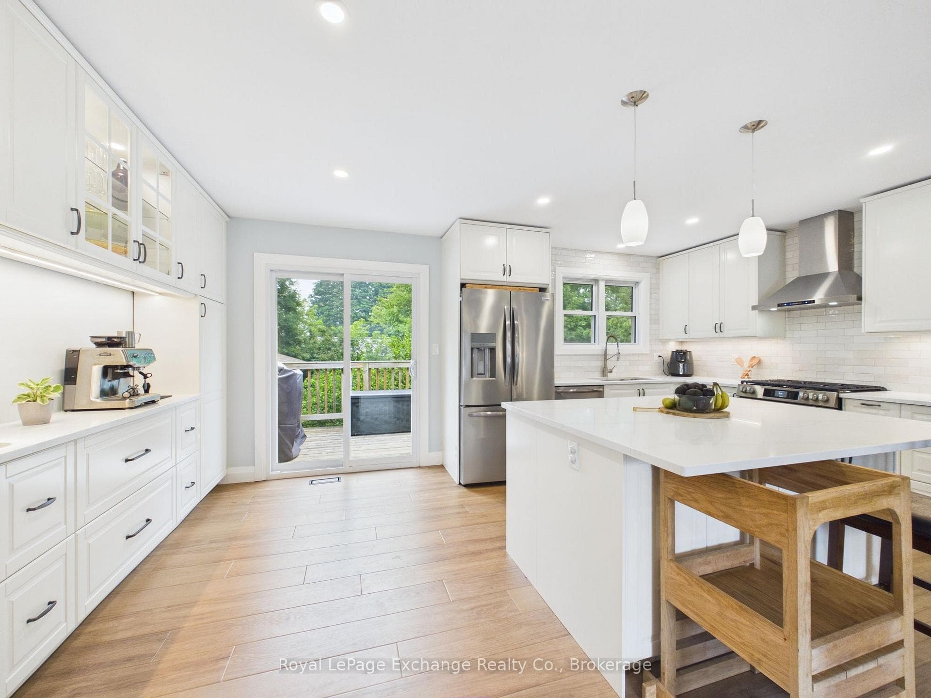 Built-in coffee bar and cabinets; walk-out to deck