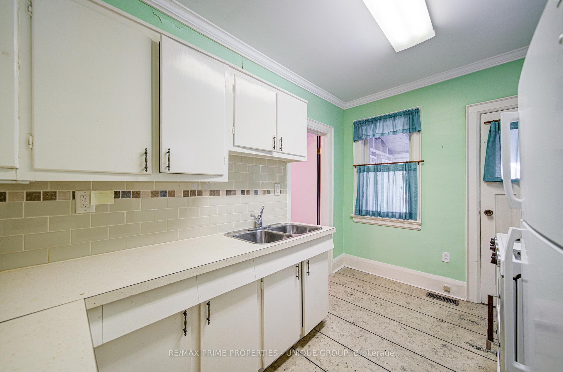 Kitchen with door to sunroom