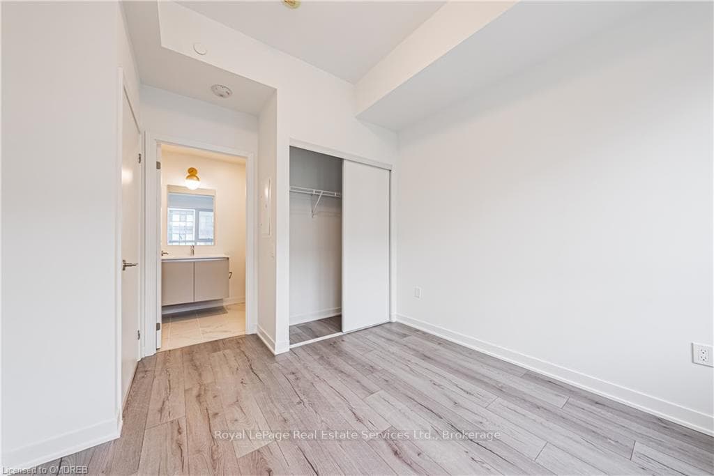 Unfurnished bedroom with a closet and light hardwo