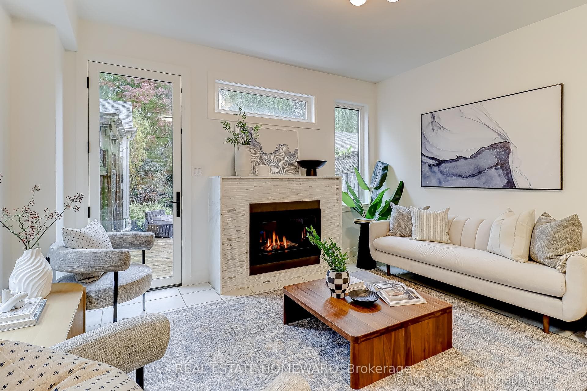Family room w/ fireplace & walkout to deck