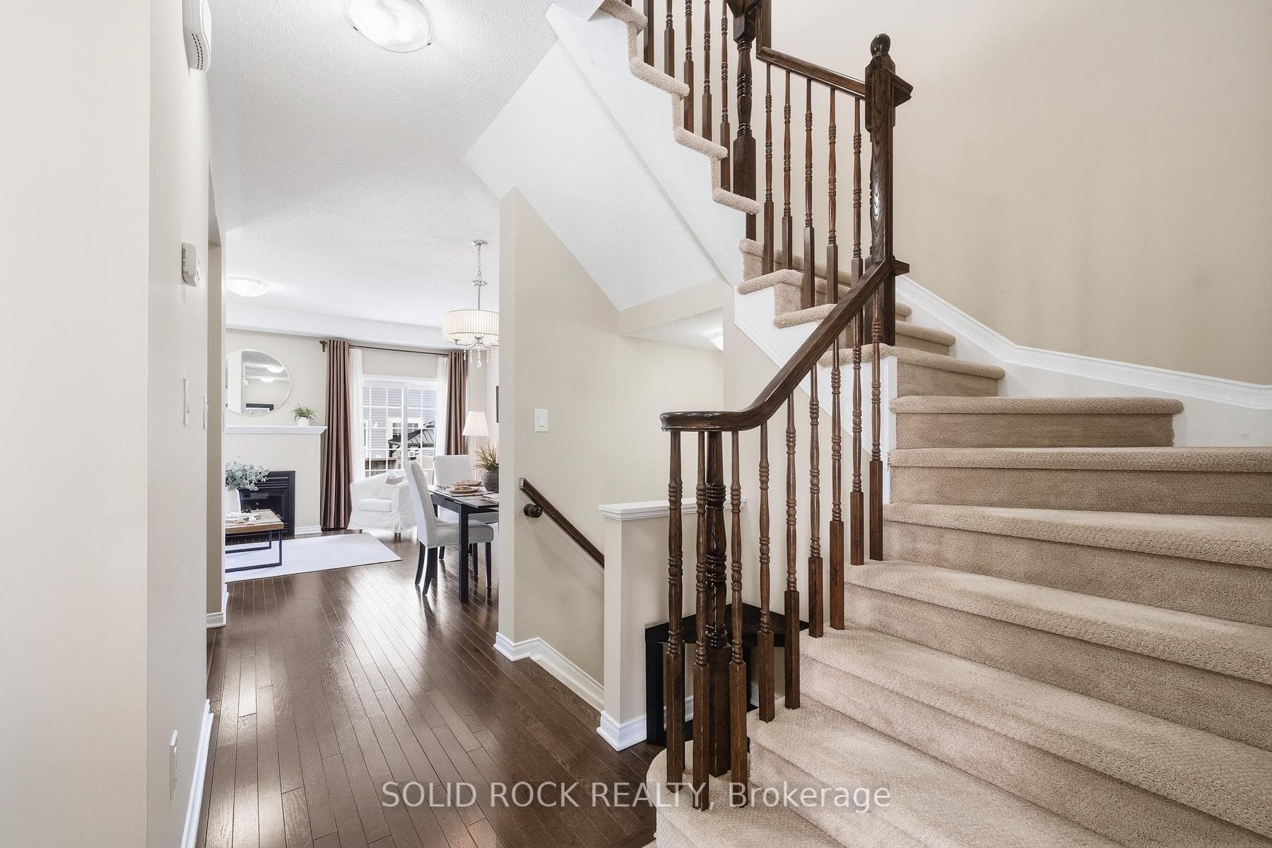 Modern curved stairs with hardwood railing