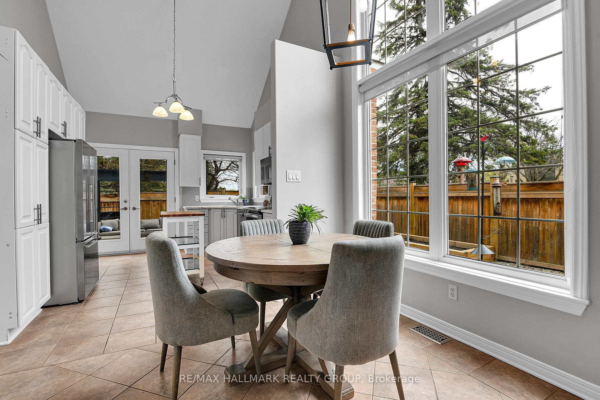 DINING | 2 storey window, tranquil side yard view