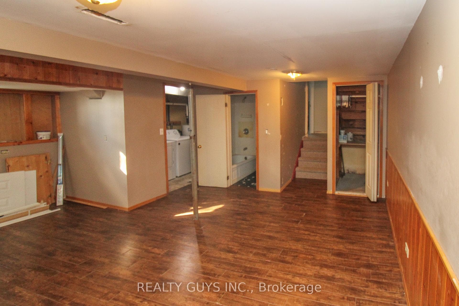LOWER FAMILY ROOM WITH BATH AND LAUNDRY