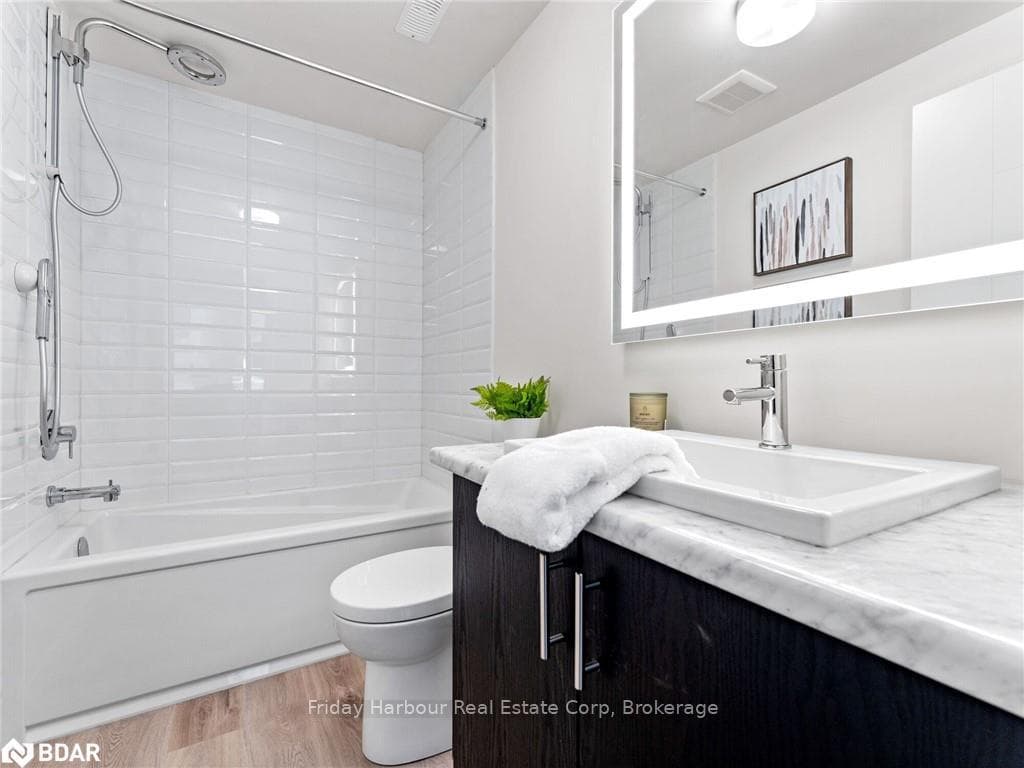 Full bathroom with hardwood / wood-style floors, v