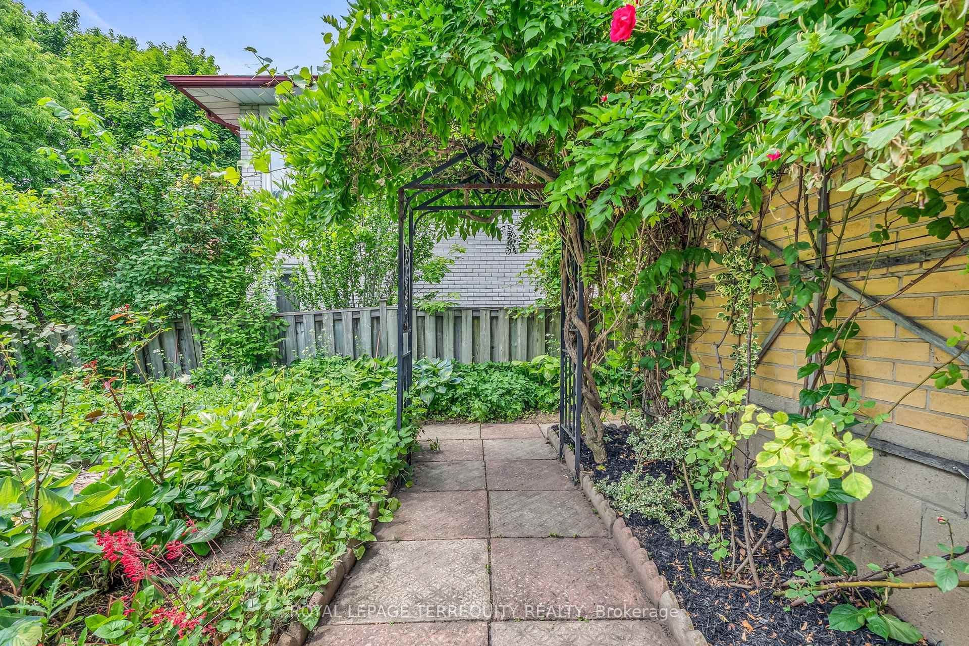Beautiful gardens and archways to patio