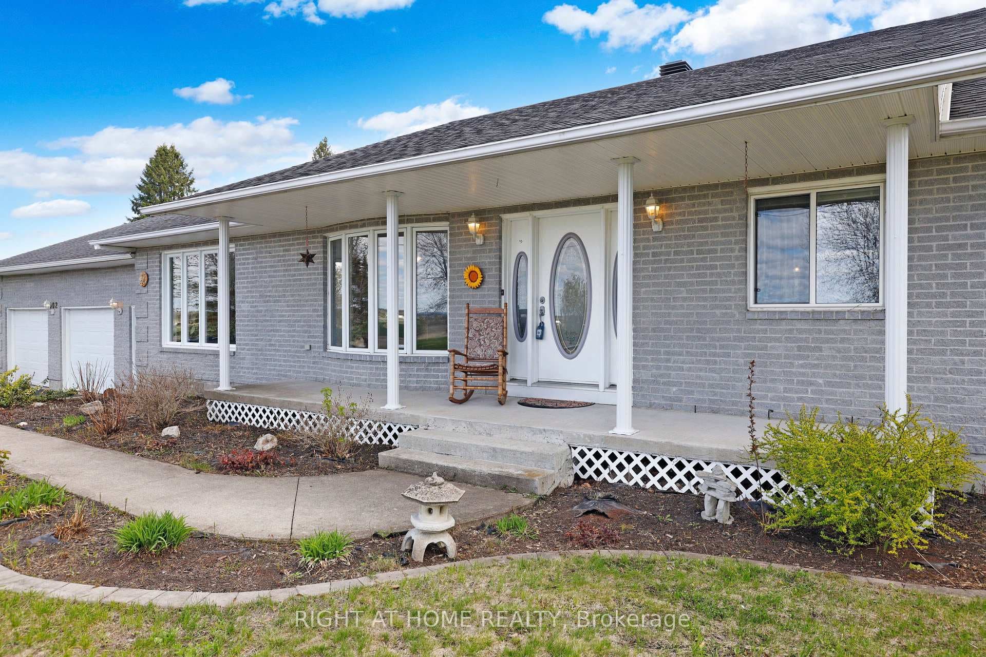 Covered front Entrance with Garden