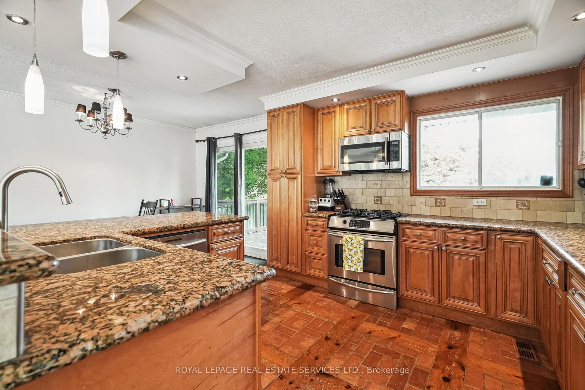 Kitchen & Dining Area w/ Walkout to Large Deck