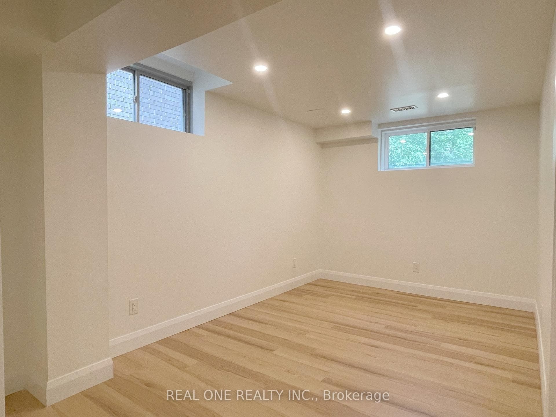 Living Room With Two Windows and Potlight