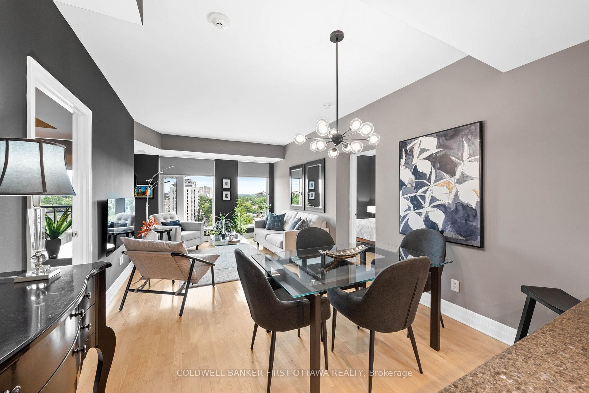 Leads into the elegant dining space w/ chandelier.
