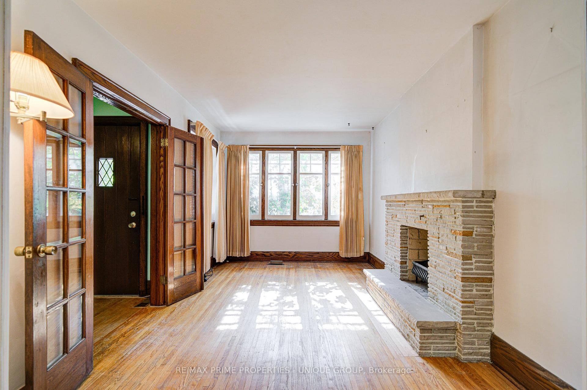 Living room fireplace and south facing window.