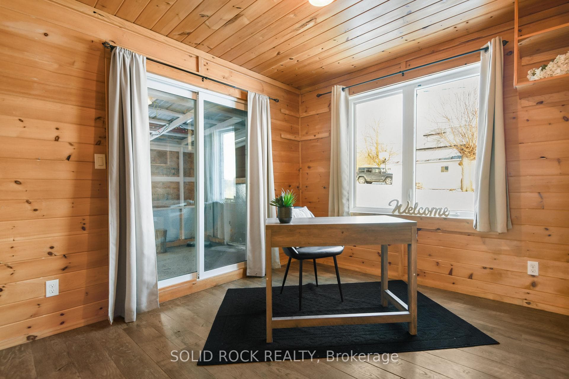 Sliding doors lead to storage/workshop area