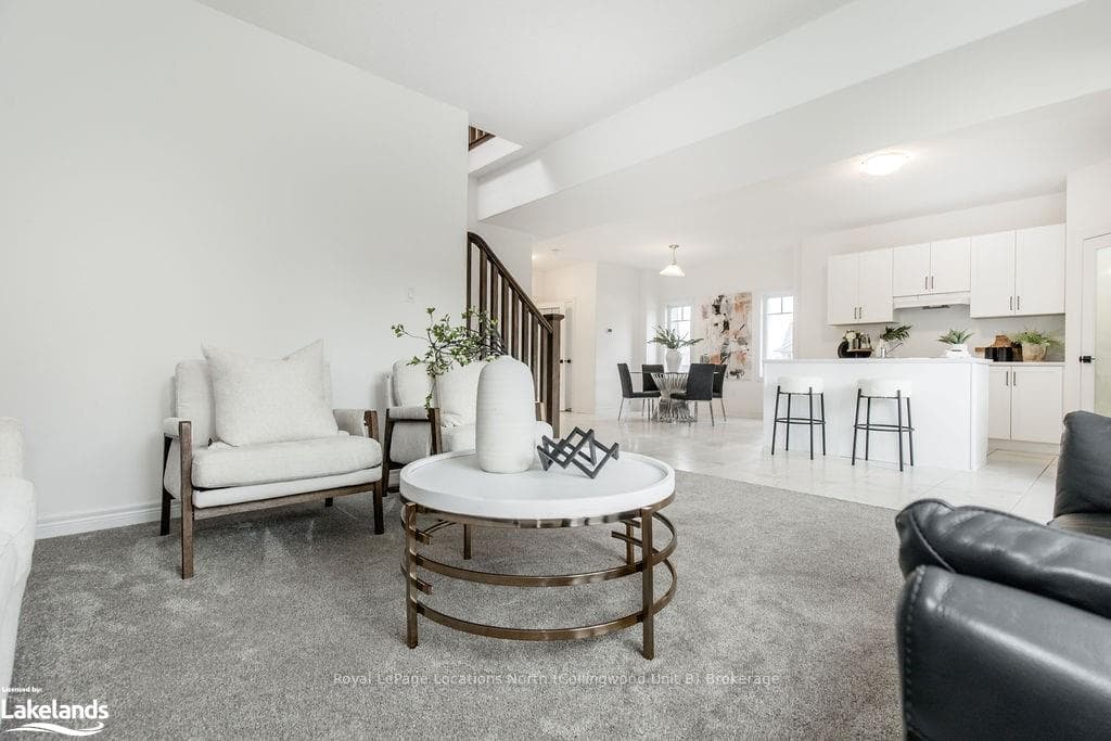Living room featuring light colored carpet