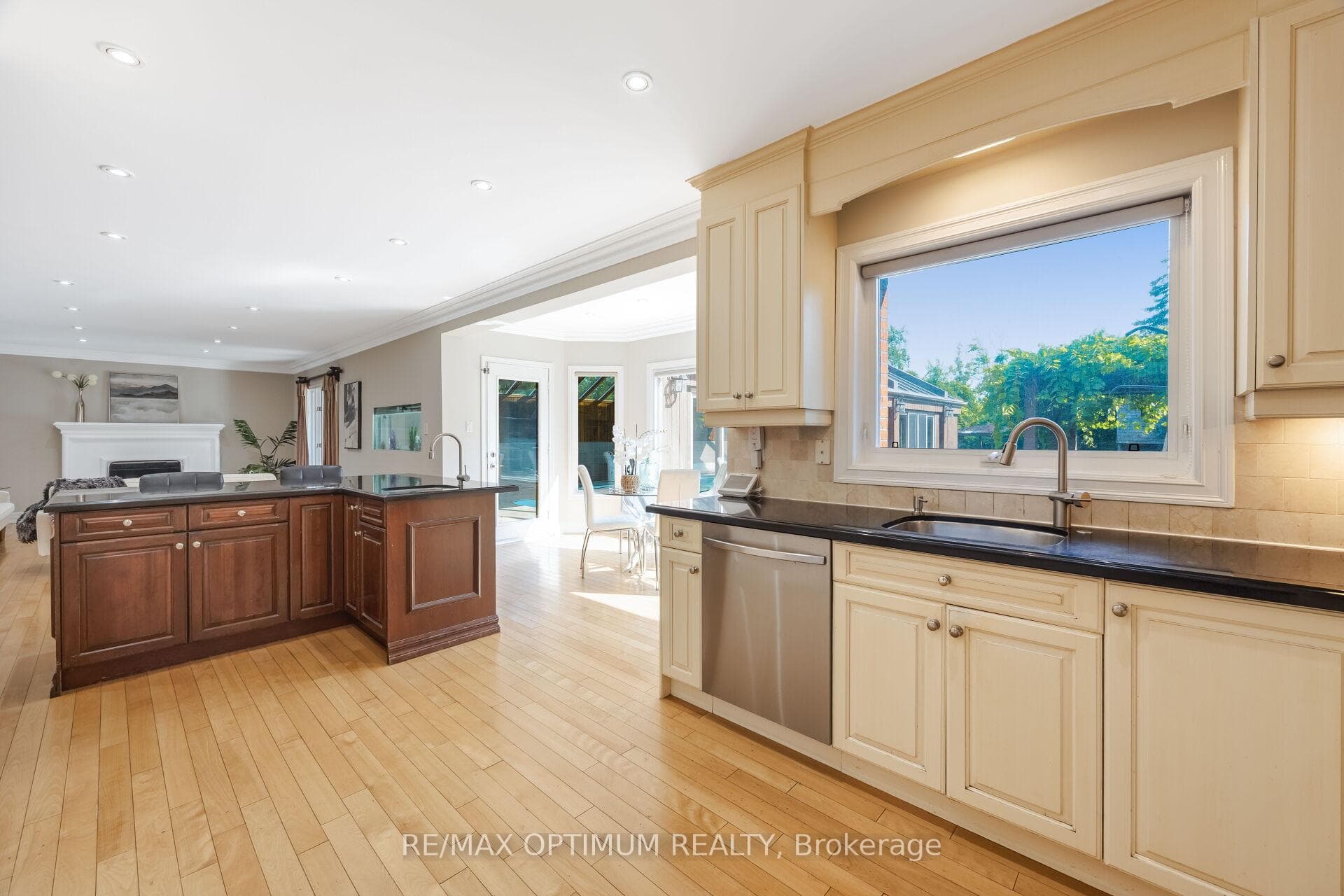 Sunlit kitchen overlooking the backyard