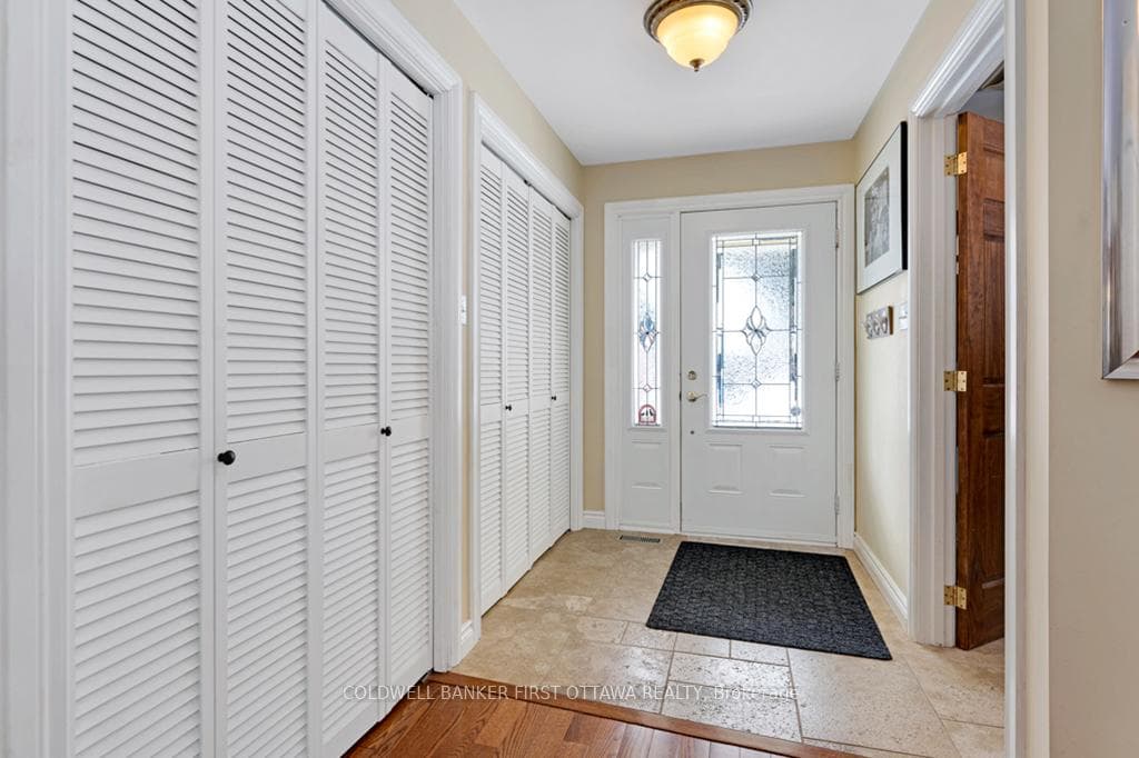 Rear foyer has laundry station and storage closets