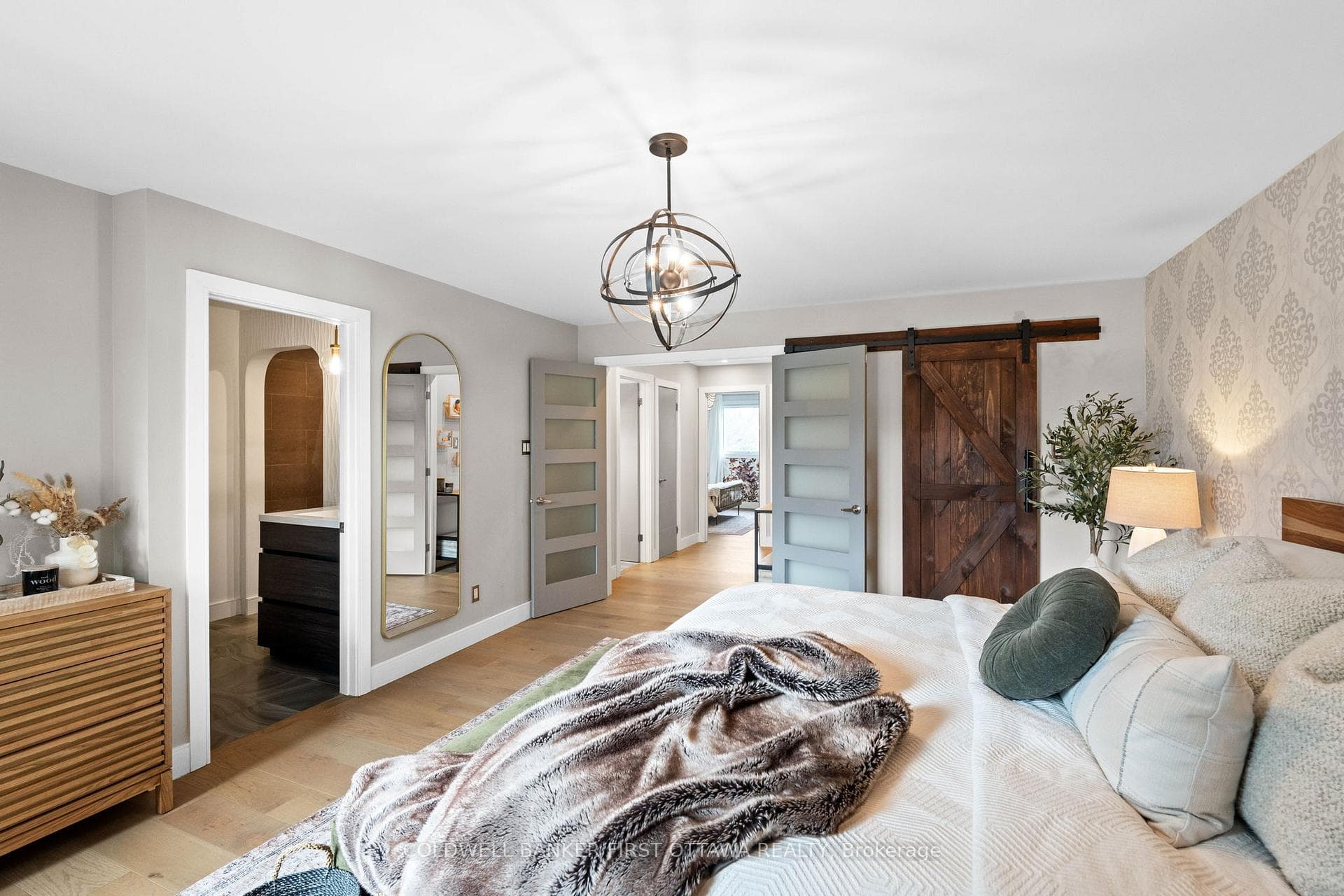 Double door entry and sliding barn style closet.