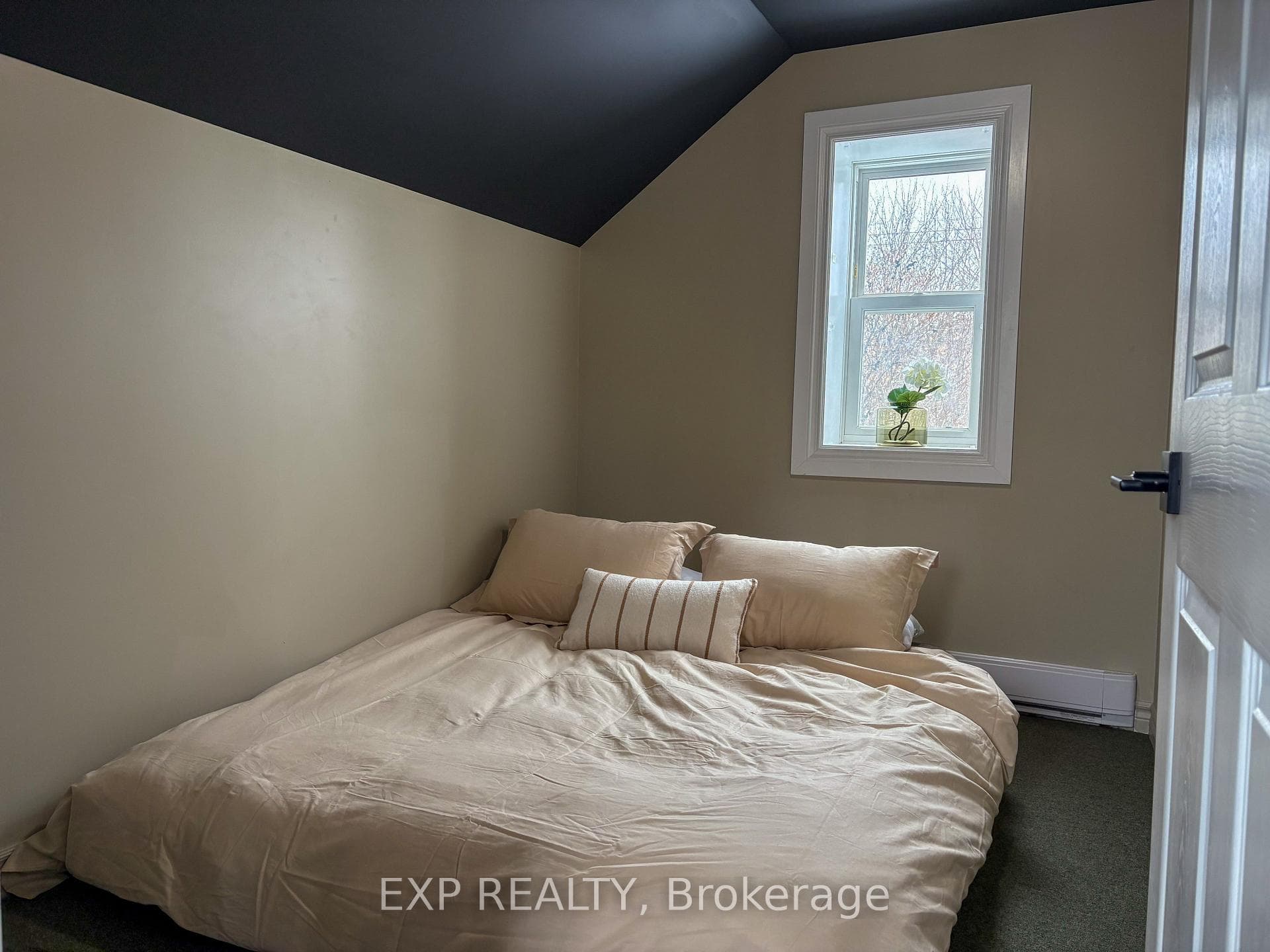 The bedroom fits a queen bed
