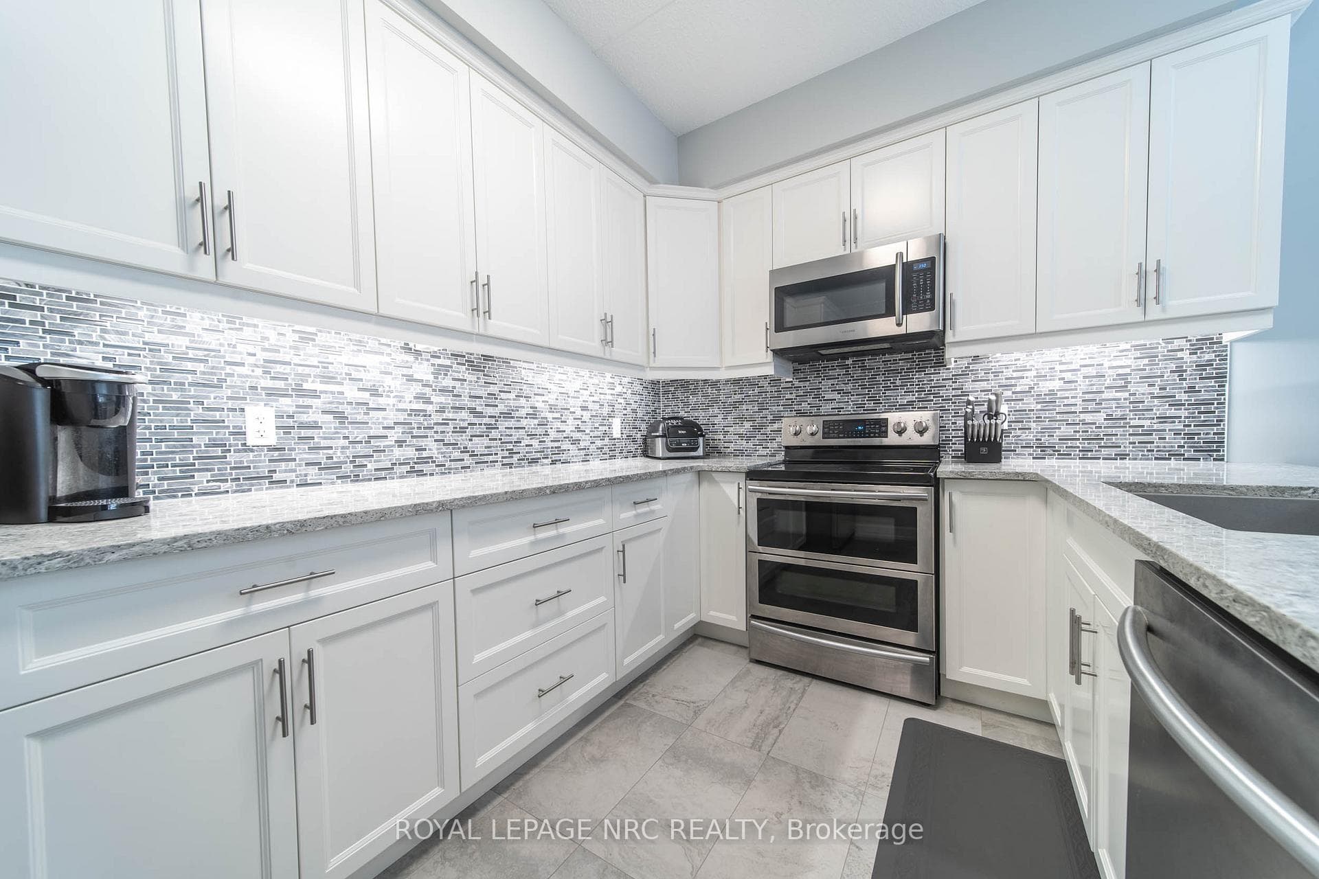 Comfort height cabinetry, quartz countertops