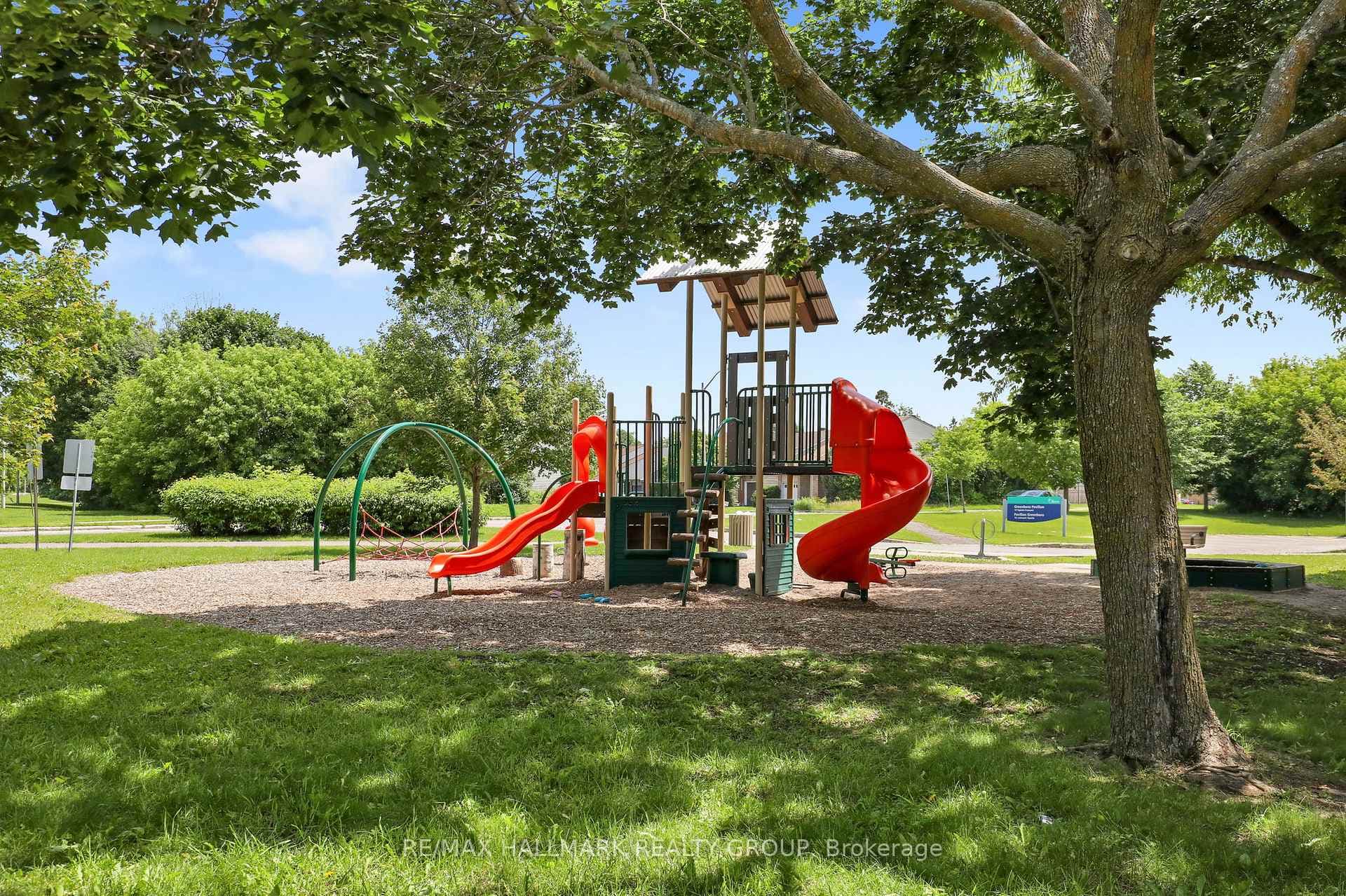 kid play structure in park across the street