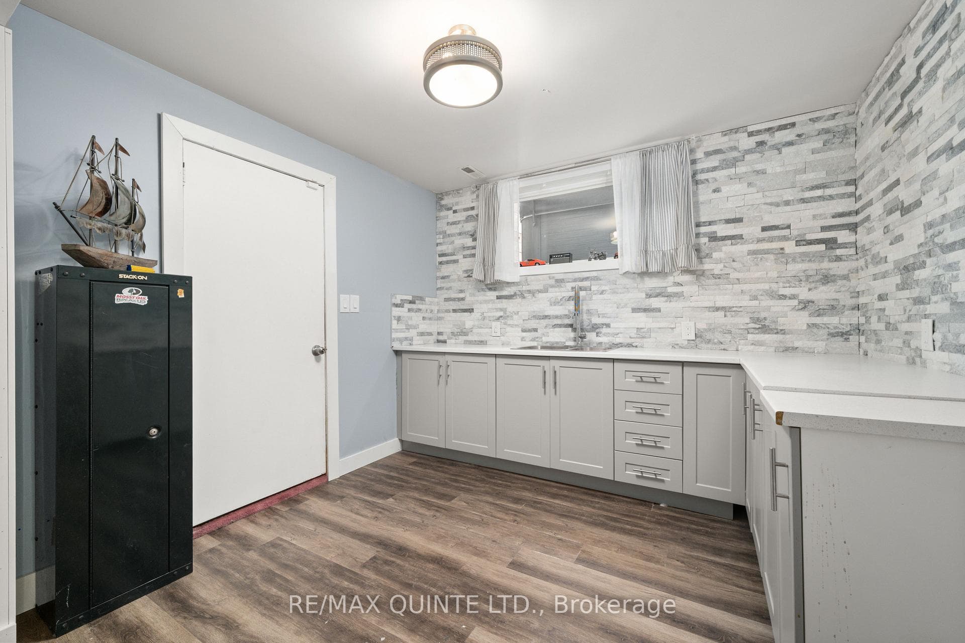 Lower level kitchen with access to garage