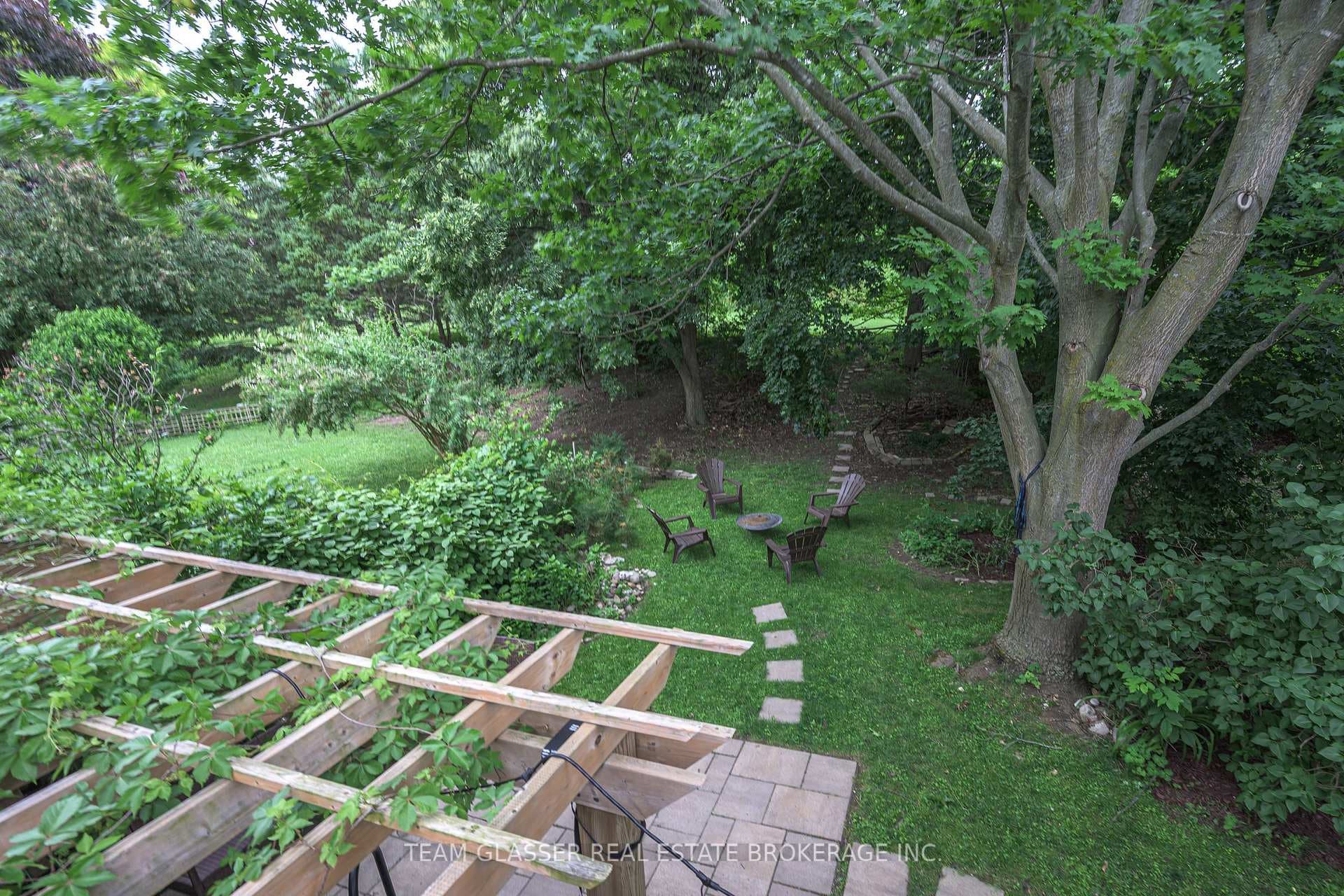 Deck overlooking hottub and treed yard